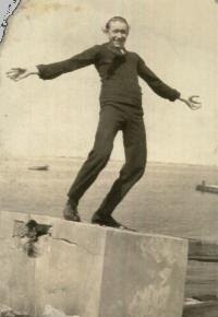 Henry balancing on a block, his sister's caption: Statue of Tricks